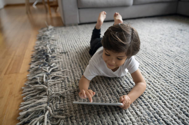 Girl lying on rug | DeHaan Tile & Floor Covering