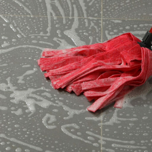 Mopping the floor tiles | DeHaan Tile & Floor Covering