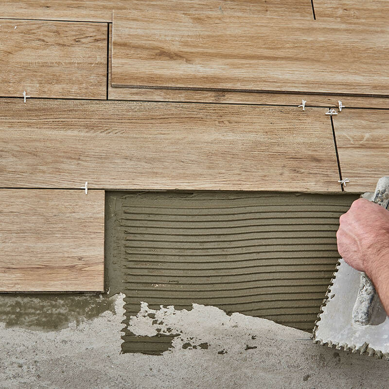Man installing tile | DeHaan Tile & Floor Covering